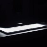 Setup - Photography of Macbook Half Opened on White Wooden Surface