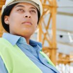 Visibility - Woman Wearing Helmet and Safety Vest