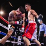Competitors - Low-Angle Photo of Two Men Fighting in Boxing Ring